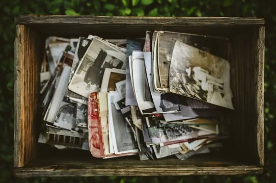 old photos in a wooden chest